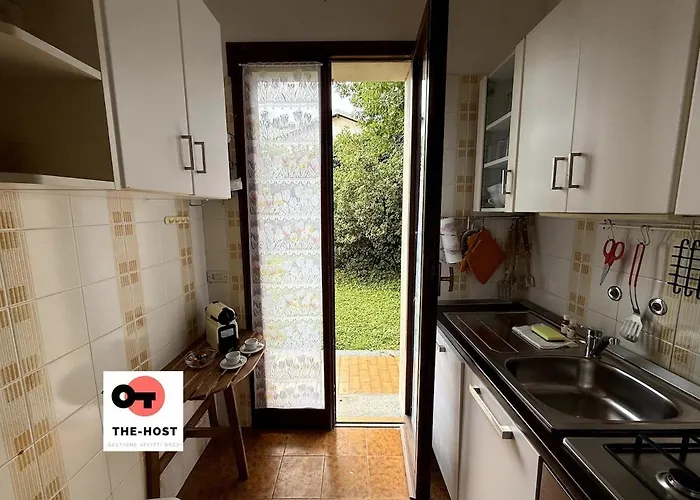 Between Greenery And The Lake, A In