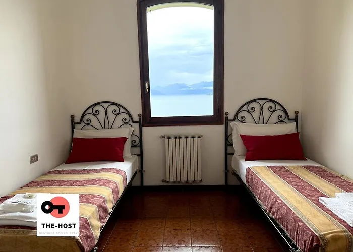 Between Greenery And The Lake, A In