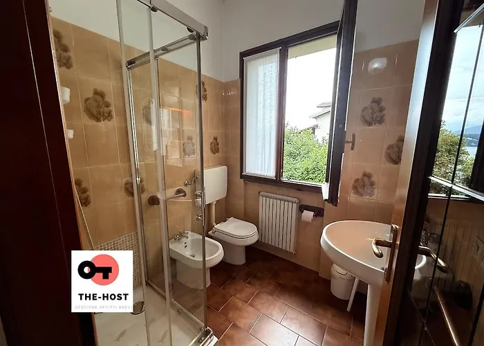 Between Greenery And The Lake, A In *